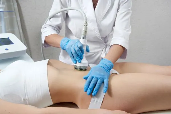 Lost the Weight but Not the Loose Skin? 2 woman having HIFU treatment on her stomach to combat loose skin West Sussex following weight loss
